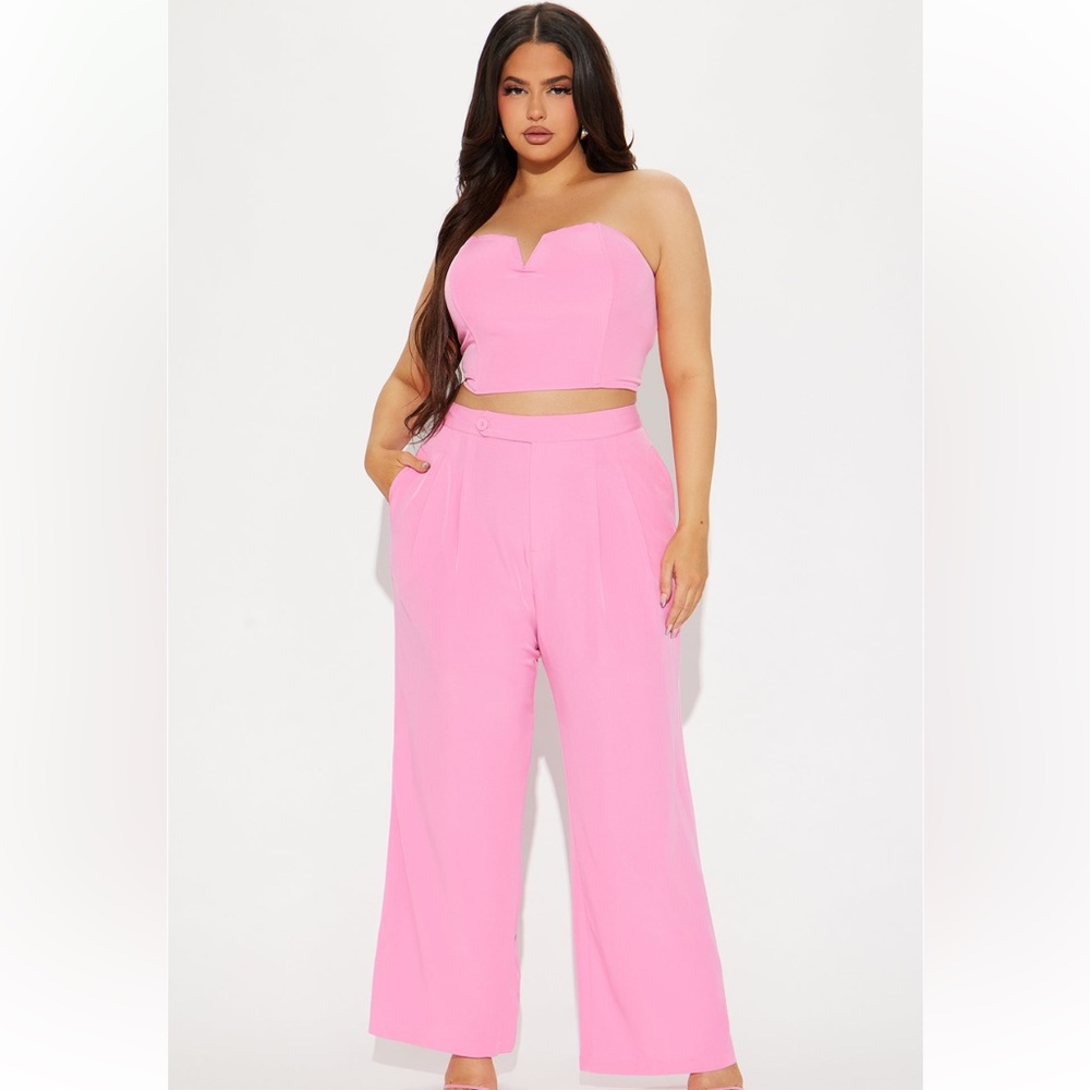 Pink strapless two-piece blazer set with crop top and wide-leg pants.🩷